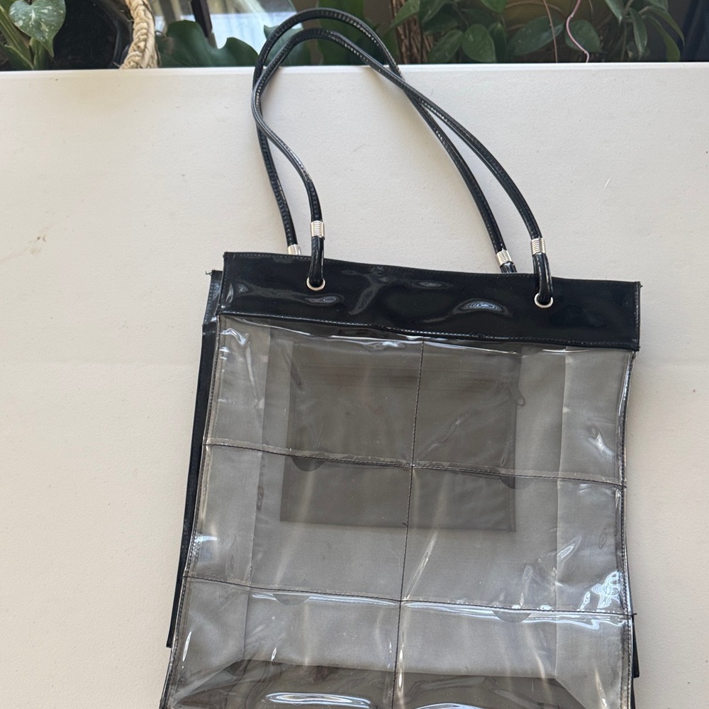 Avon tote bag that holds photos.